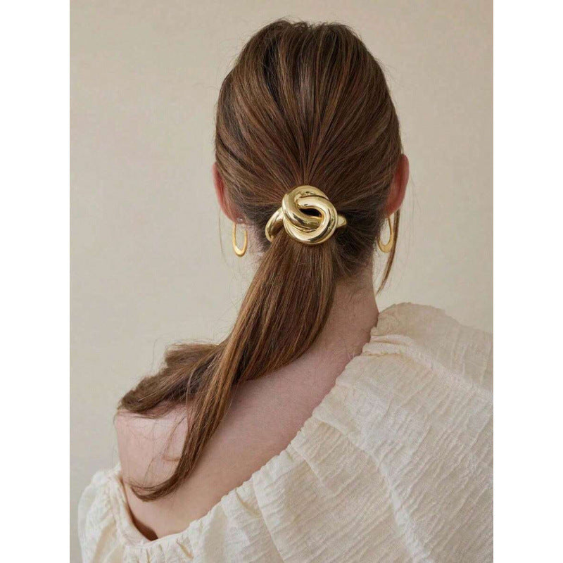 HAIR TIE AS A GOLDEN KNOT