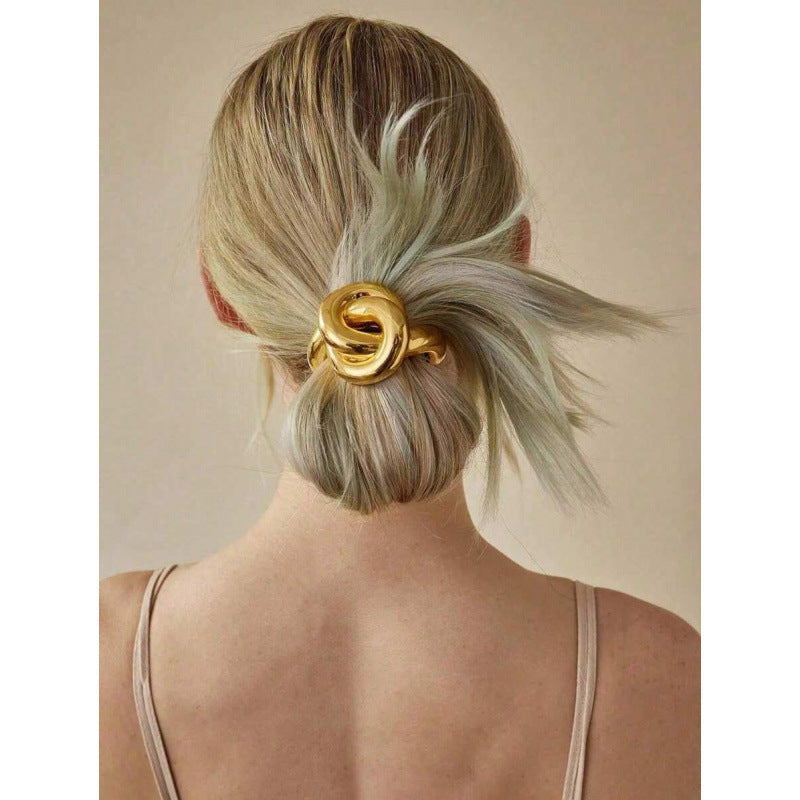 HAIR TIE AS A GOLDEN KNOT