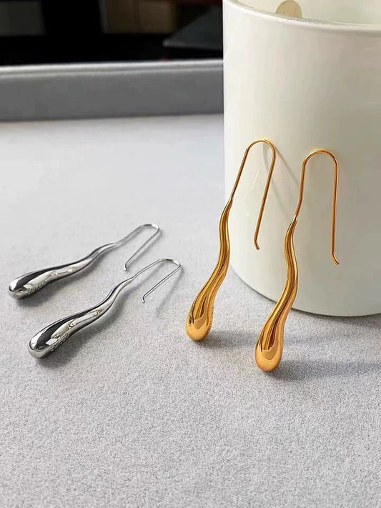 A SLENDER PAIR OF EARDROPS AS IN BLACK DOVES SILVER OR GOLD